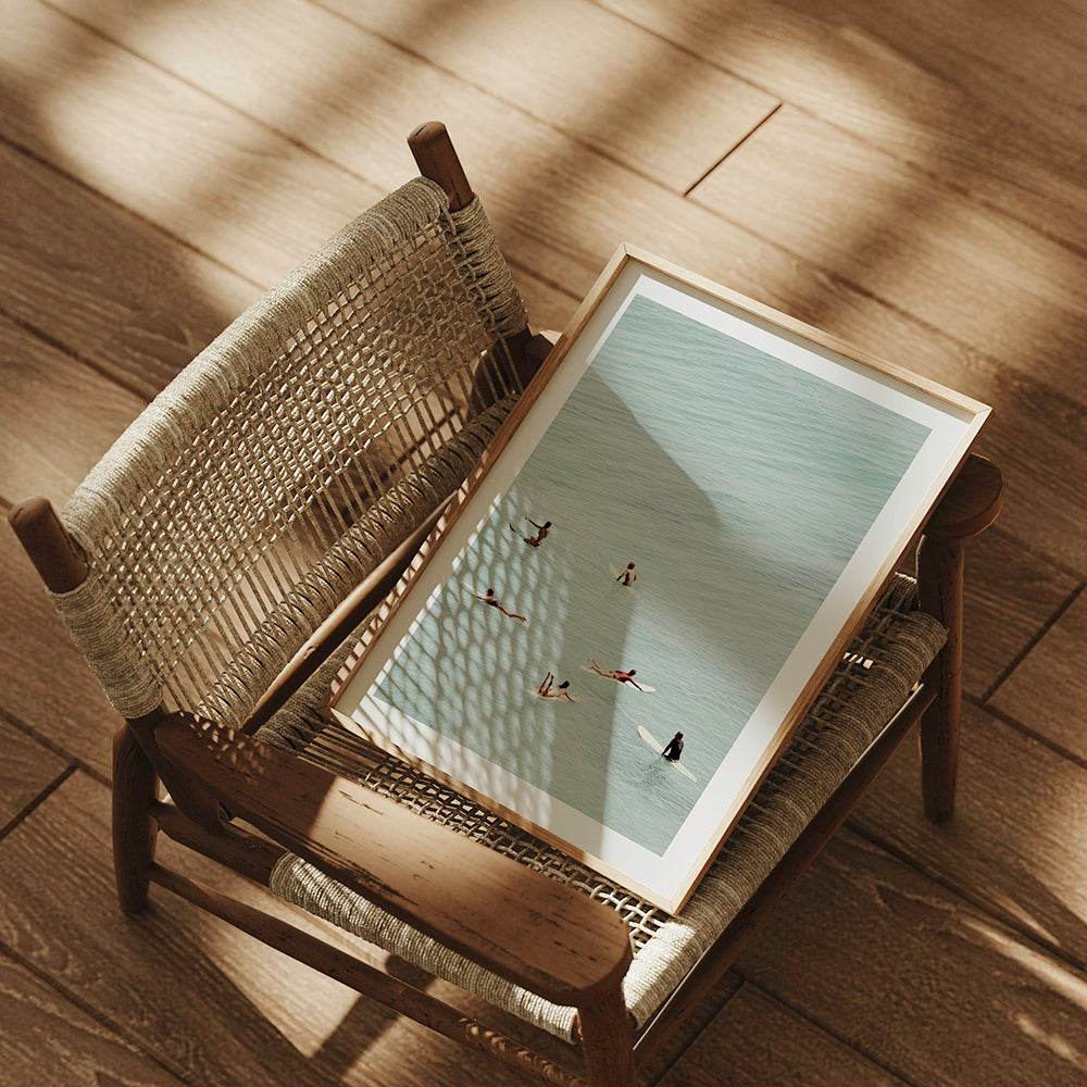 Framed surf print on a chair