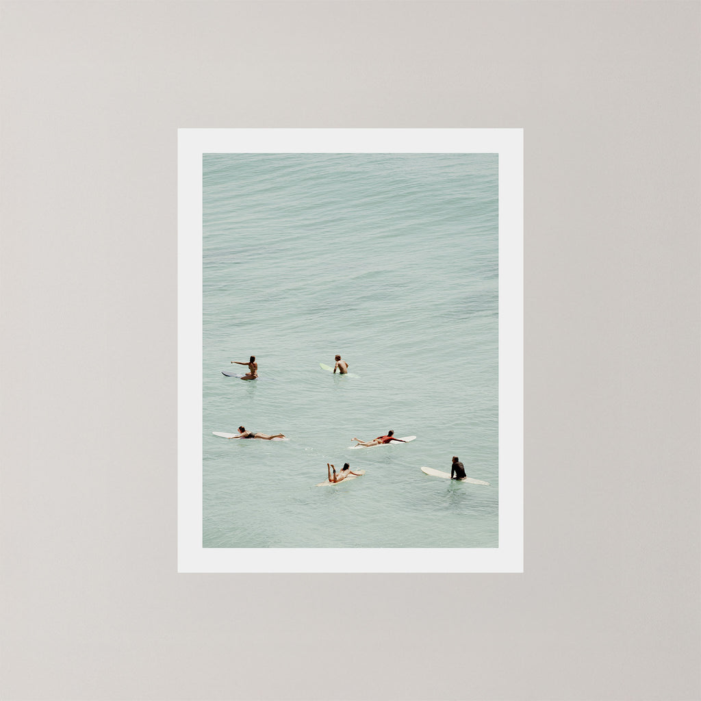 Fine photography artwork of people on surfboards in the water in Byron Bay.