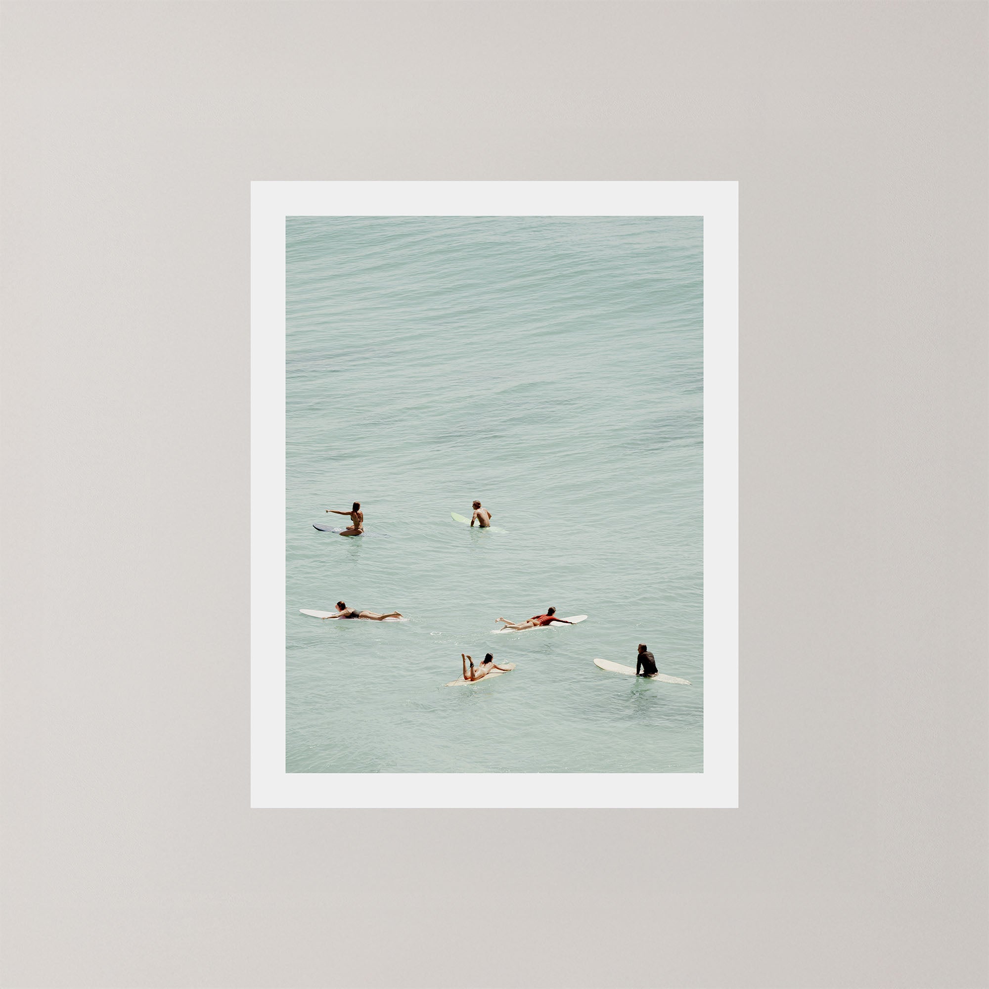 Fine photography artwork of people on surfboards in the water in Byron Bay.