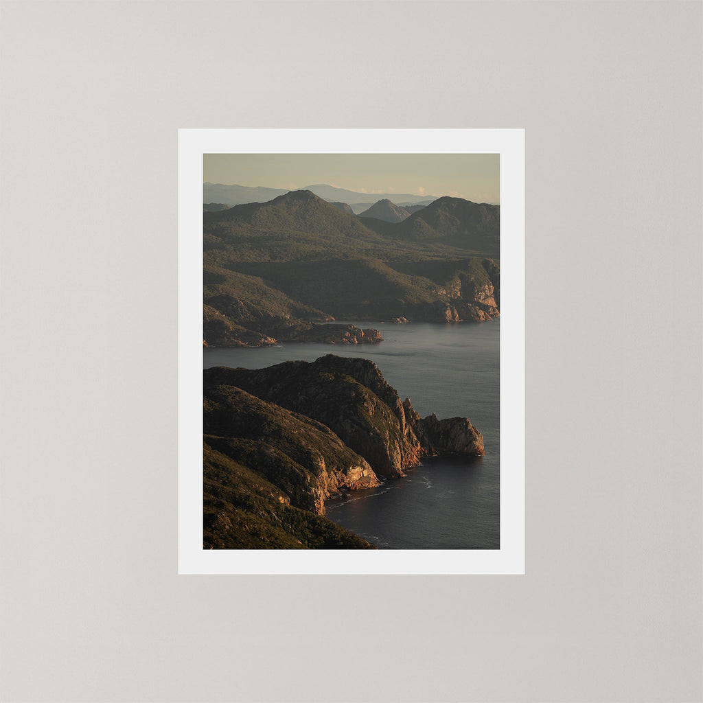 Freycinet photography art print showing an aerial view of the Tasmanian coastline and ocean at sunrise.