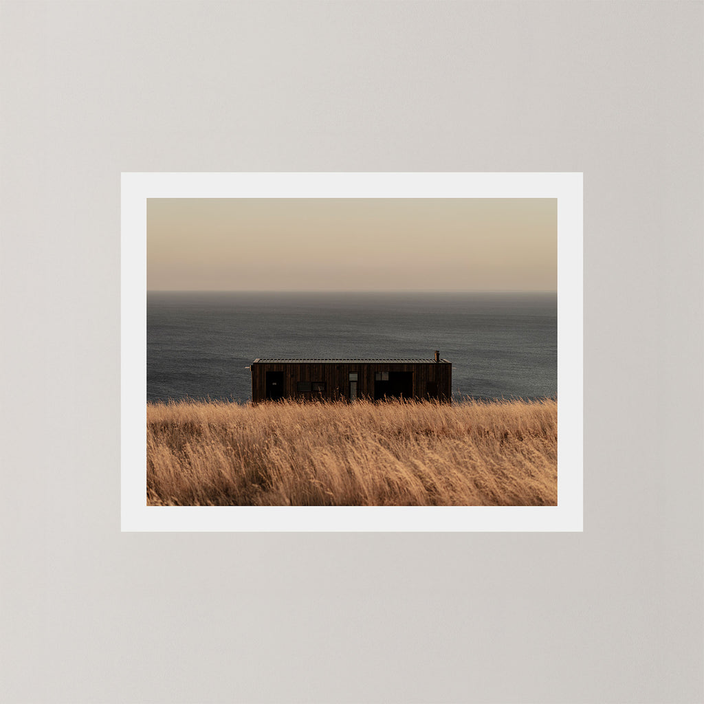 Haven photography art print of a serene coastal scene with a small building and ocean on Kangaroo Island, Australia.