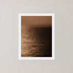 Photography art print of the Sydney ocean illuminated by moonlight, with rich golden and dark tones.