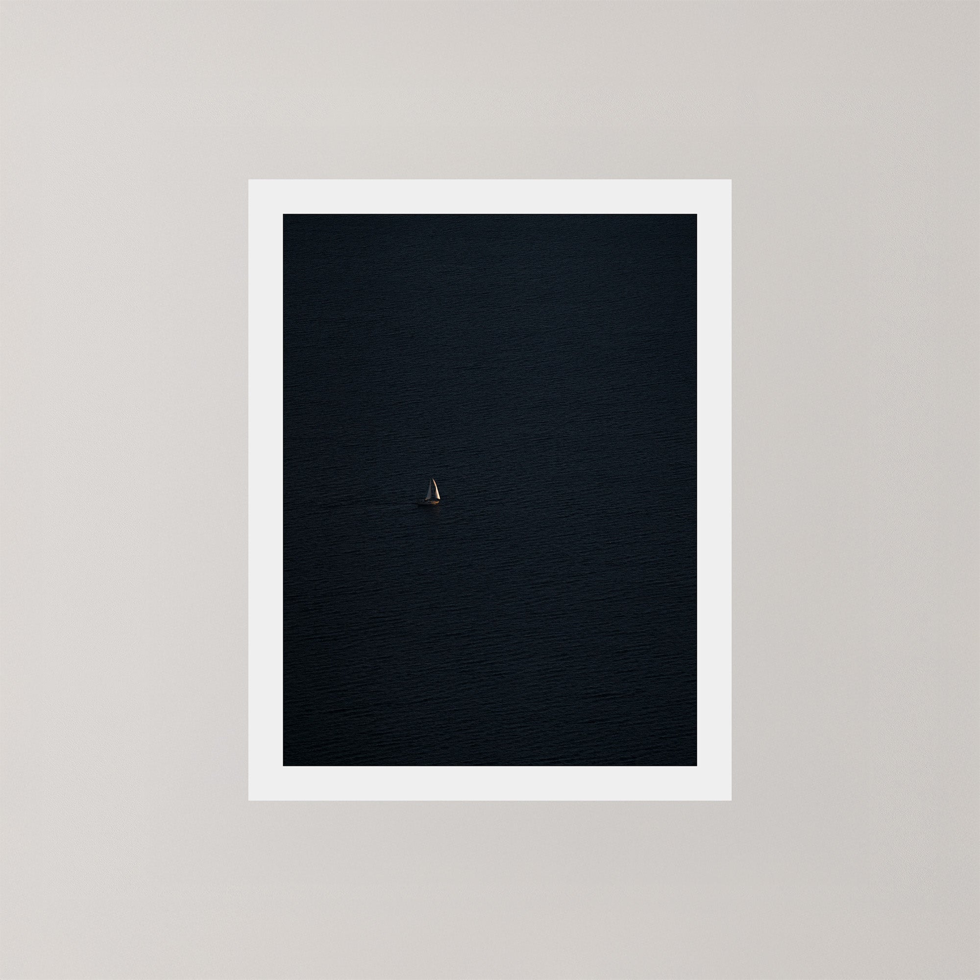 Voyage unframed art print featuring a single sailing boat on the ocean.